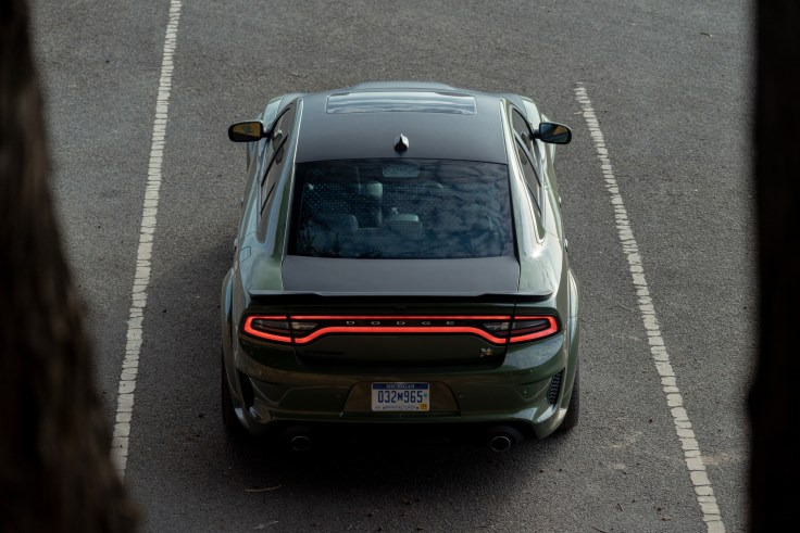 2020 Dodge Charger Scat Pack Widebody in F8 Green exterior color with Satin Black Painted hood, roof and deckli.
